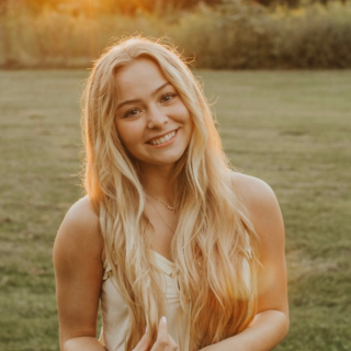 Scarlet Munoz standing in field outside