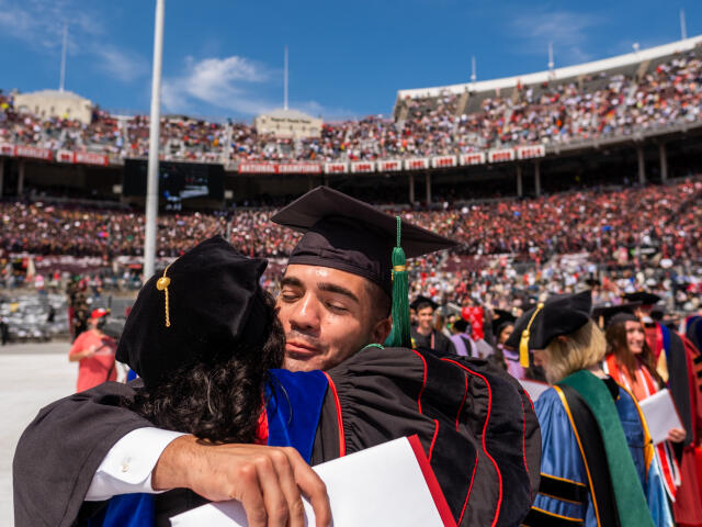 Student Hugs Professor at Graduation